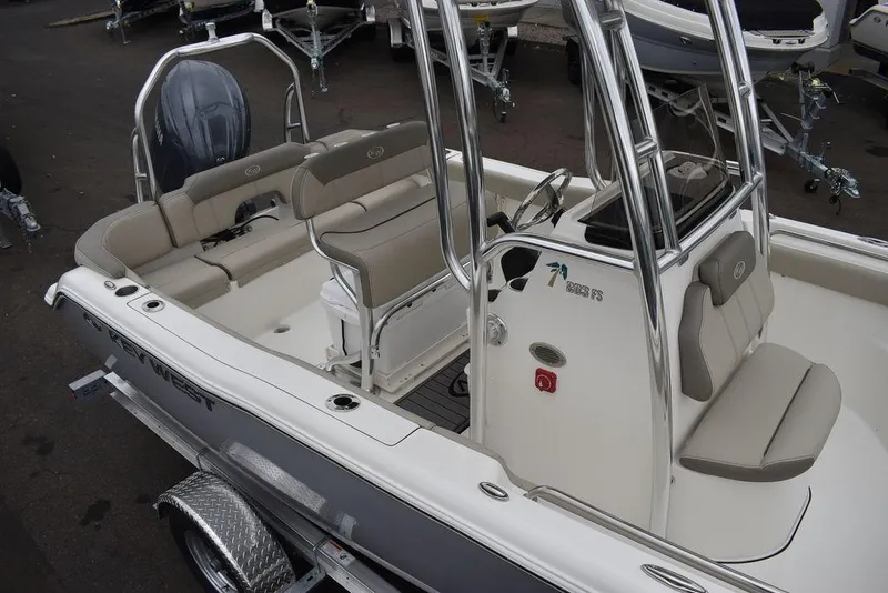 Slide: The Image of 2024 Key West 203 FS boat with beige seating and sleek design. - 12