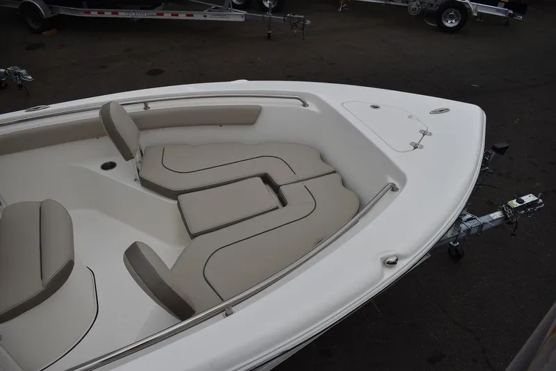 Slide: The Image of 2024 Key West 203 FS boat interior with beige seating and sleek design. - 13