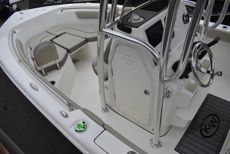 Slide: The Image of 2024 Key West 203 FS boat interior with seating and steering console. - 17