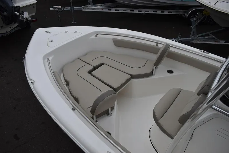 Slide: The Image of 2024 Key West 203 FS boat interior with beige seating and sleek design. - 18