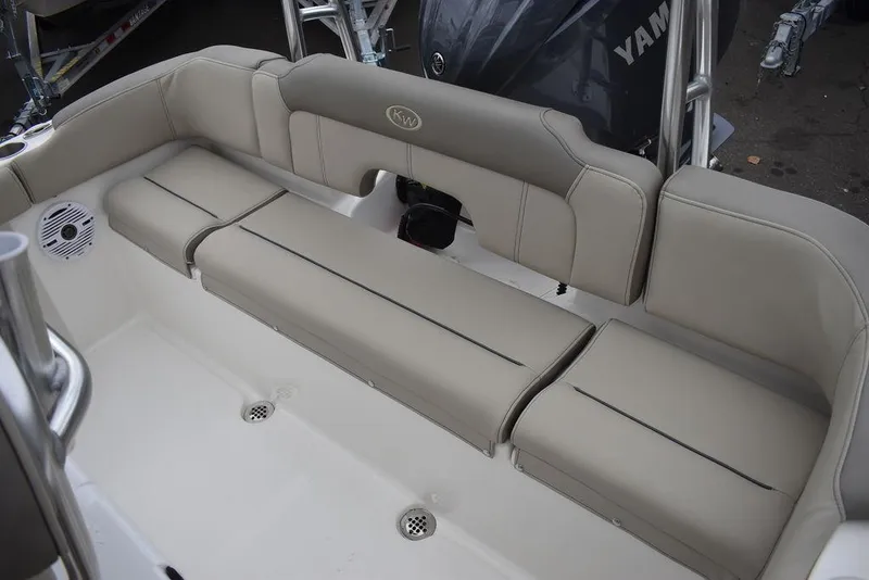 Slide: The Image of 2024 Key West 203 FS boat interior with beige seating and Yamaha engine. - 23