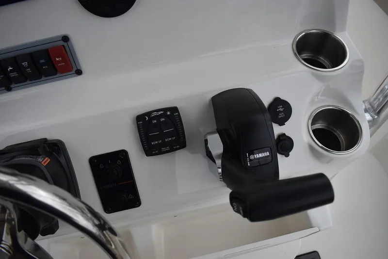 Slide: The Image of 2024 Key West 203 FS boat console with Yamaha controls and cup holders. - 32