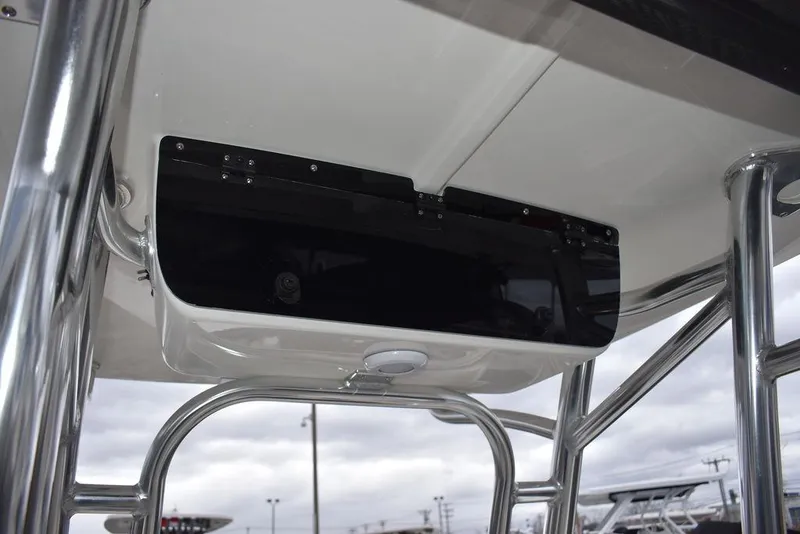 Slide: The Image of 2024 Key West 203 FS boat console with stainless steel frame and storage compartment. - 33