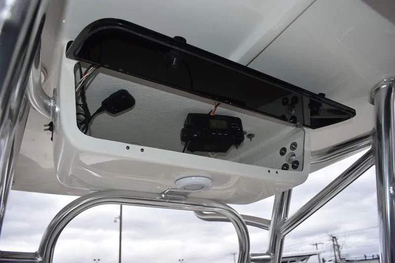 Slide: The Image of 2024 Key West 203 FS boat console with radio and storage compartment. - 34