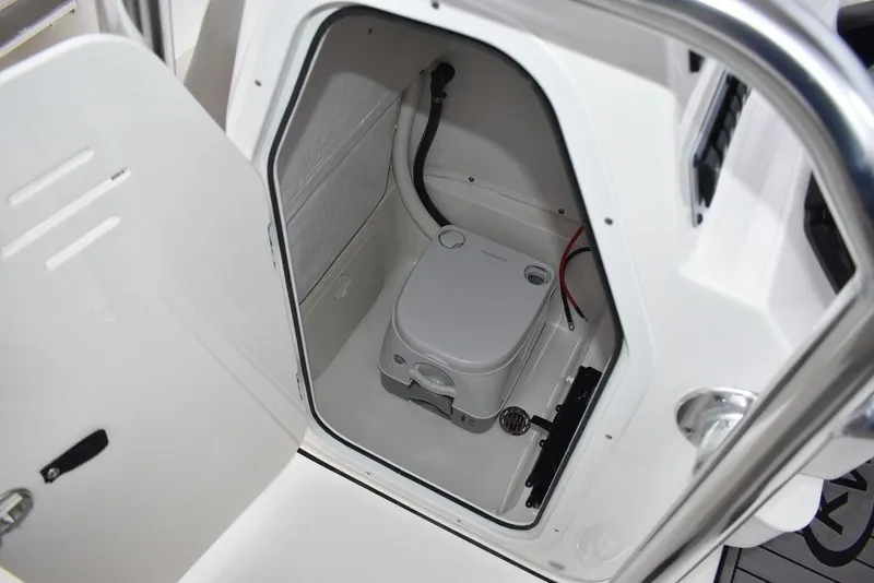 Slide: The Image of 2024 Key West 203 FS boat interior with compact marine toilet. - 35