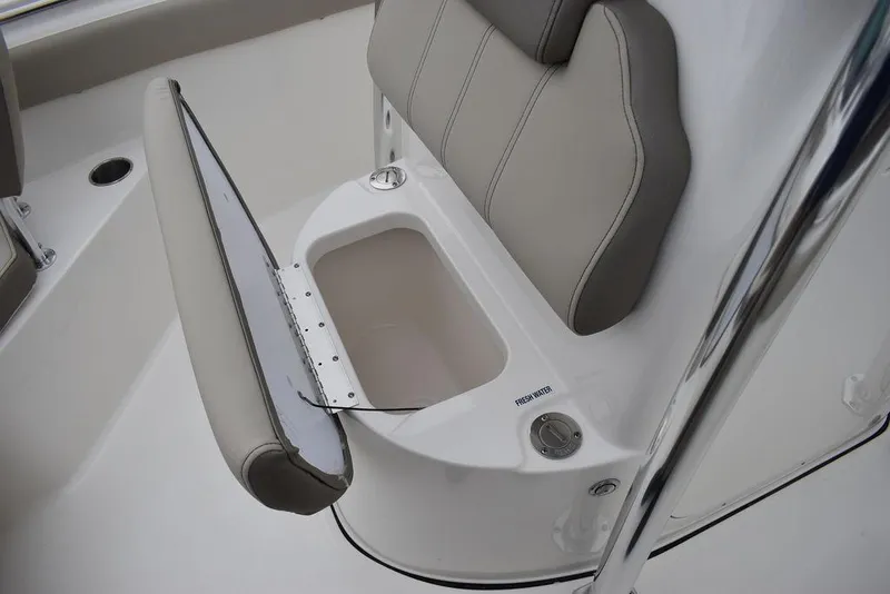 Slide: The Image of 2024 Key West 203 FS boat seat with storage compartment open. - 37