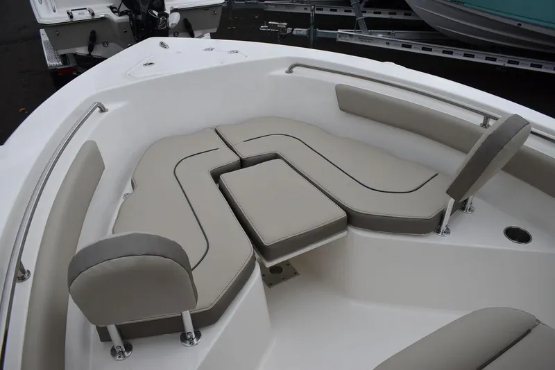 Slide: The Image of 2024 Key West 203 FS boat interior with cushioned seating and sleek design. - 39