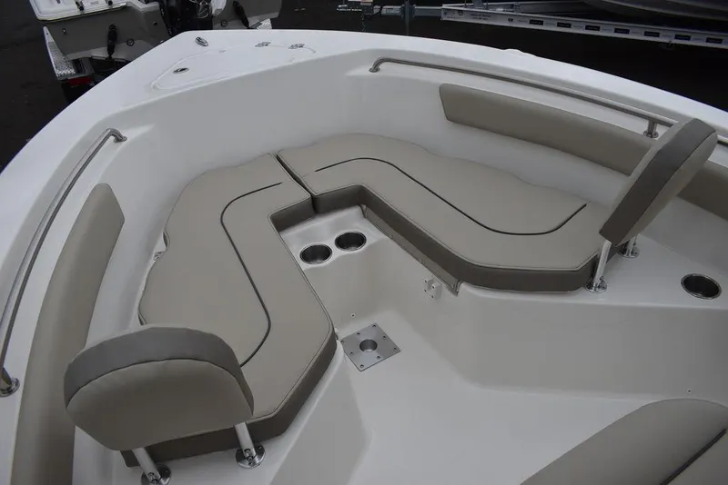 Slide: The Image of 2024 Key West 203 FS boat interior with cushioned seating and cup holders. - 40