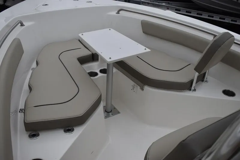 Slide: The Image of 2024 Key West 203 FS boat interior with cushioned seating and table. - 44