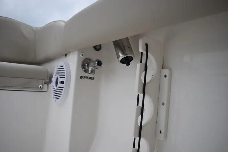 Slide: The Image of 2024 Key West 203 FS boat interior with raw water outlet and speaker. - 48