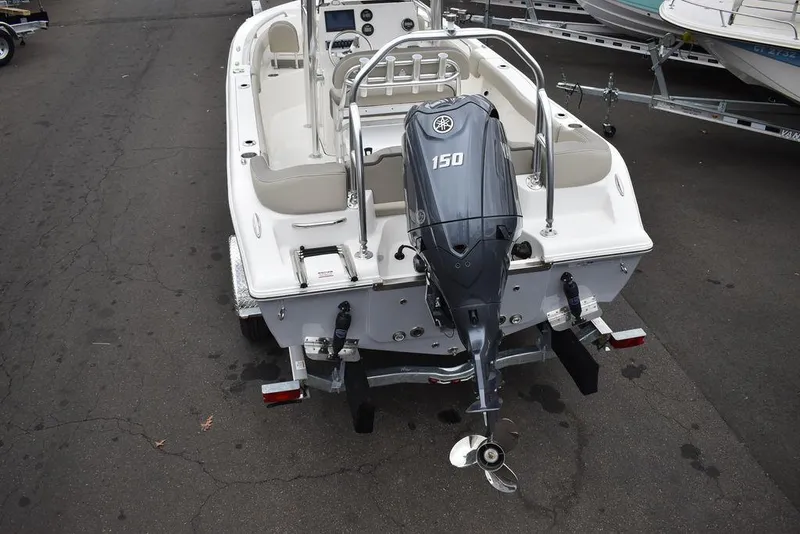 Slide: The Image of 2024 Key West 203 FS boat with 150 HP outboard motor, rear view. - 8