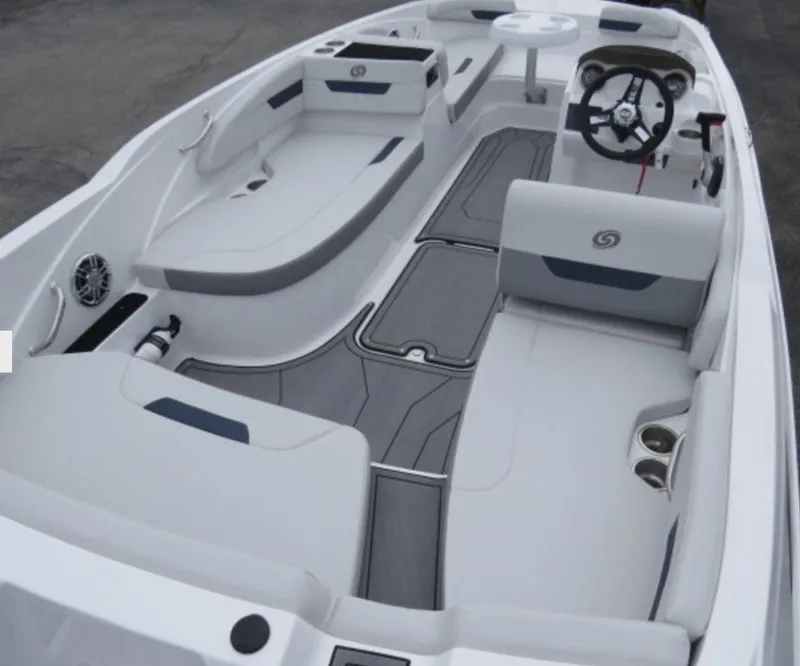 Slide: The Image of 2023 Hurricane SunDeck 185 OB boat interior with seating and steering console. - 2