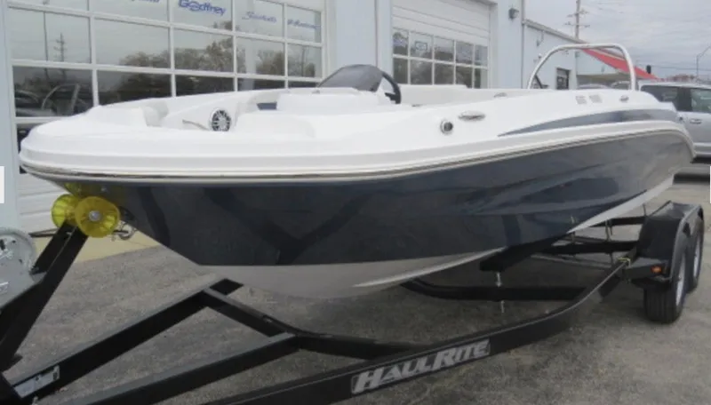 Slide: The Image of 2023 Hurricane SunDeck 185 OB boat on trailer outside dealership. - 5