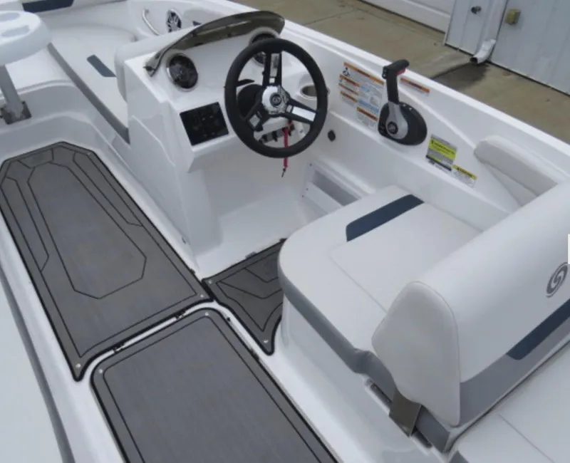 Slide: The Image of 2023 Hurricane SunDeck 185 OB boat interior with steering wheel and seating. - 7