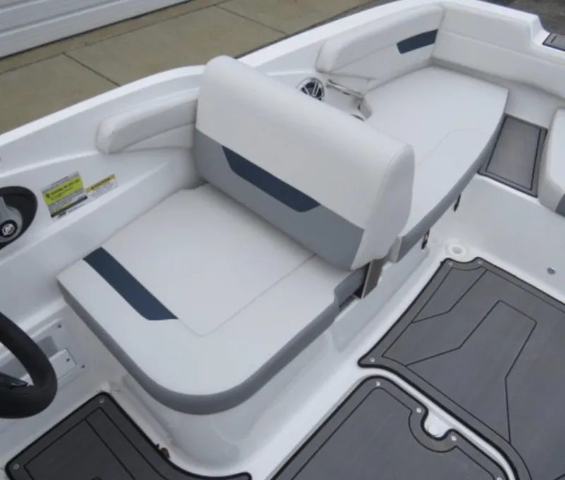 Slide: The Image of 2023 Hurricane SunDeck 185 OB boat interior seating area with white and gray upholstery. - 8