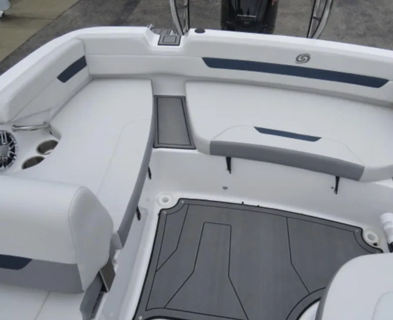 Slide: The Image of 2023 Hurricane SunDeck 185 OB boat interior with white seating and gray flooring. - 9