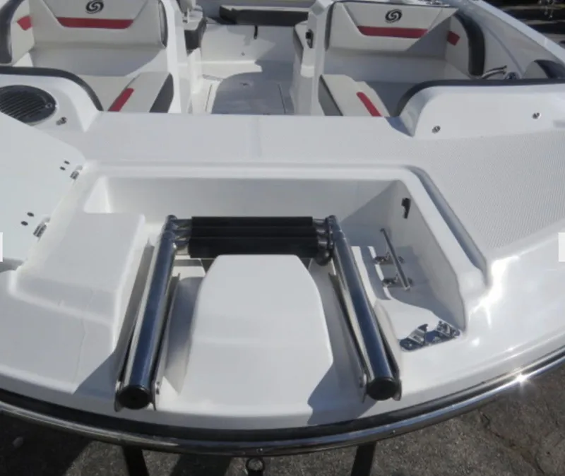 Slide: The Image of 2023 Hurricane SunDeck Sport 205 OB boat interior with seating and ladder. - 13