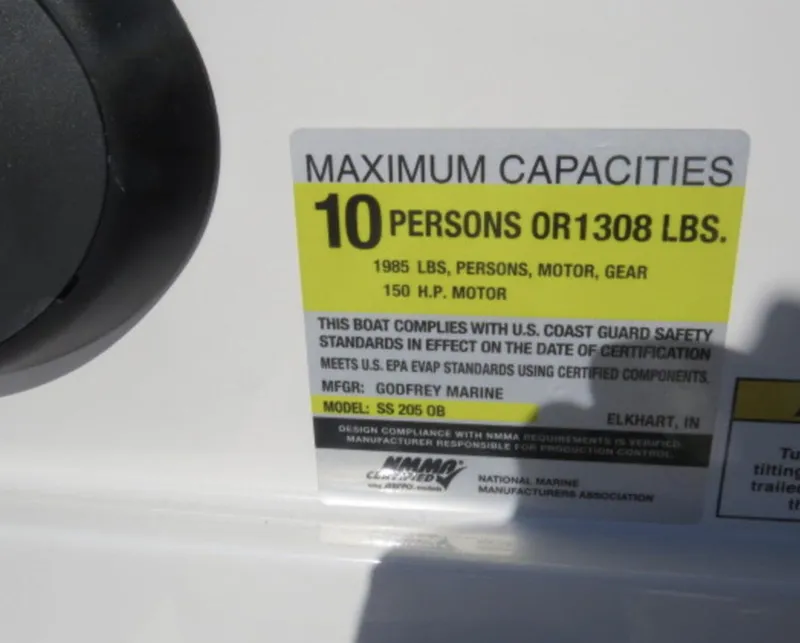 Slide: The Image of 2023 Hurricane SunDeck Sport 205 OB capacity label: 10 persons or 1308 lbs, 150 HP motor. - 8