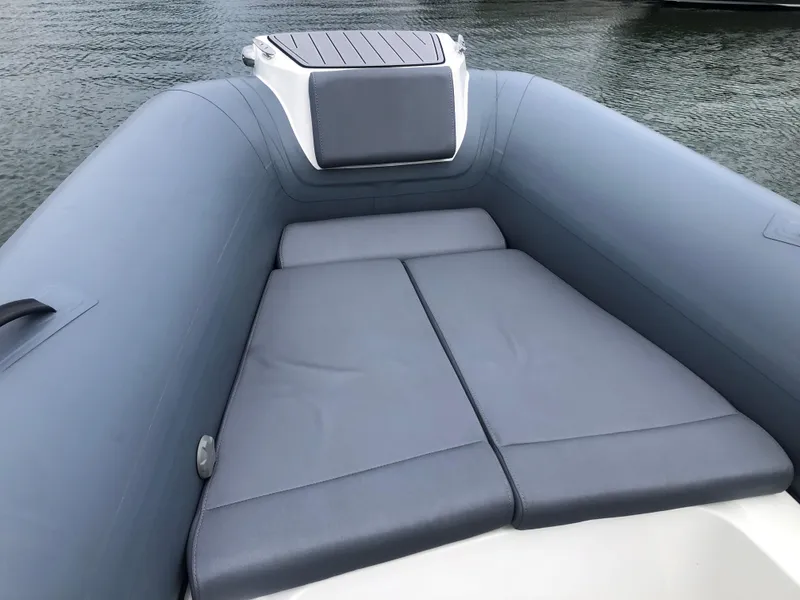 Slide: The Image of 2024 Brig Eagle 8 boat with cushioned seating area. - 11