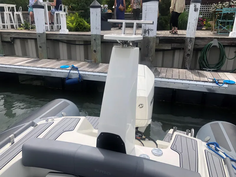 Slide: The Image of 2024 Brig Eagle 8 boat docked at a marina. - 3