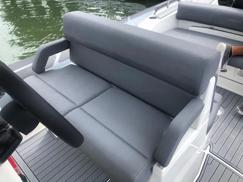 Slide: The Image of 2024 Brig Eagle 8 boat with gray cushioned seating. - 6