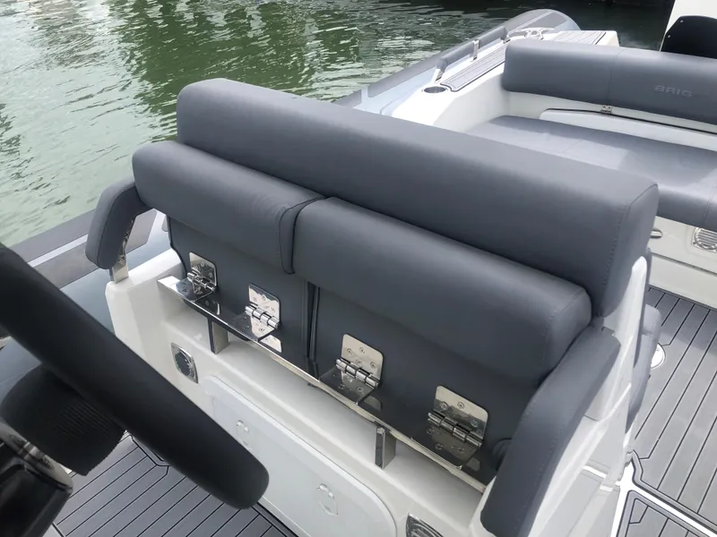 Slide: The Image of 2024 Brig Eagle 8 boat with gray seating and sleek design. - 7