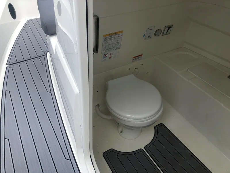 Slide: The Image of 2024 Brig Eagle 8 boat interior with marine toilet and non-slip flooring. - 9