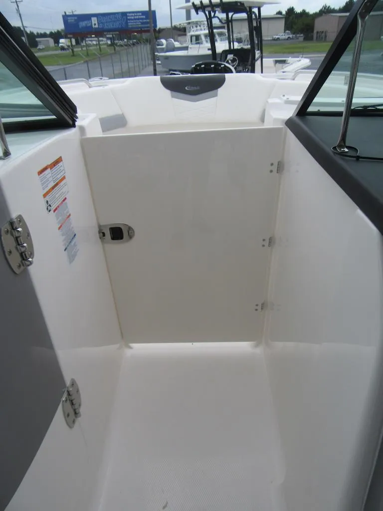 Slide: The Image of 2024 Robalo R317 Dual Console boat interior, featuring a sleek, modern design. - 12