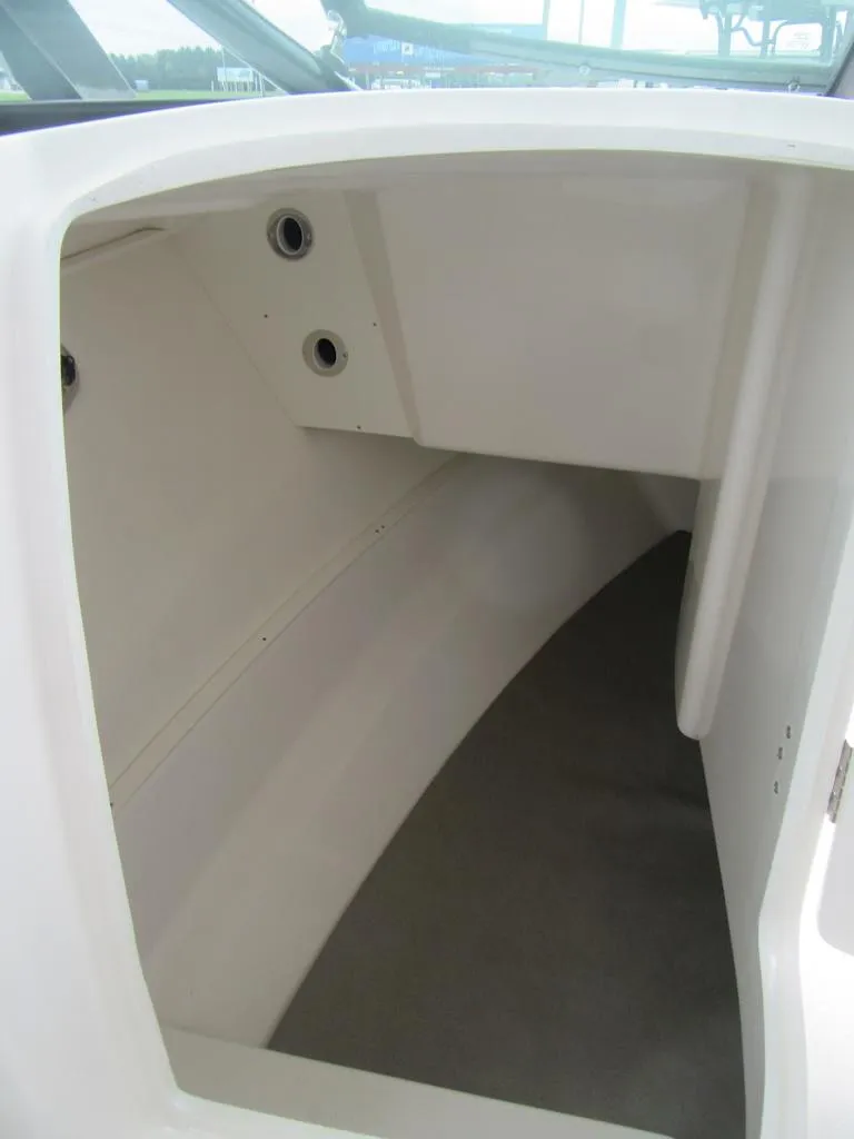 Slide: The Image of 2024 Robalo R317 Dual Console interior storage compartment. - 14