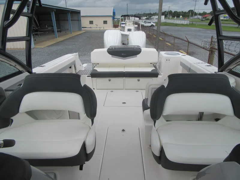 Slide: The Image of 2024 Robalo R317 Dual Console boat interior with seating and storage. - 15