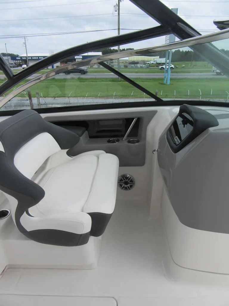 Slide: The Image of 2024 Robalo R317 Dual Console interior with sleek seating and modern dashboard. - 18
