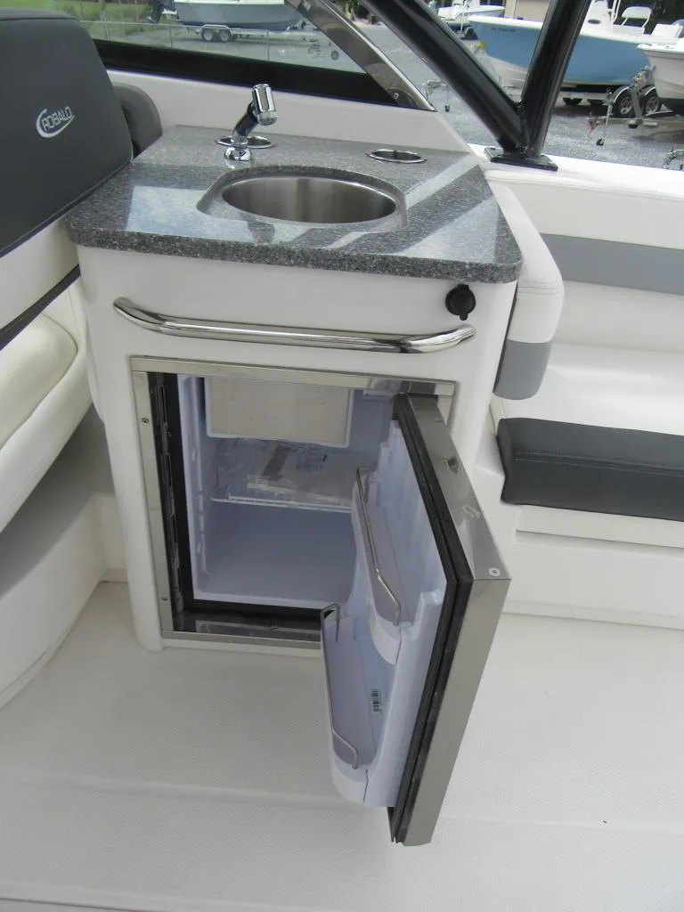 Slide: The Image of 2024 Robalo R317 Dual Console boat with sink and mini fridge. - 20