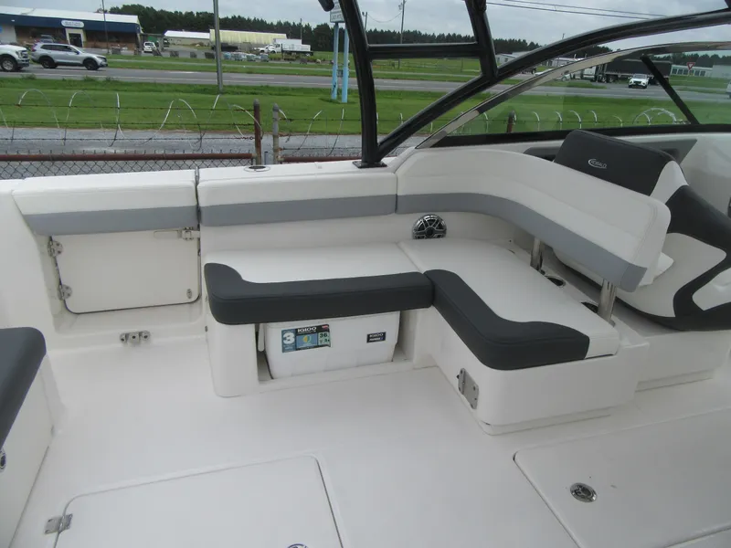 Slide: The Image of 2024 Robalo R317 Dual Console boat interior with cushioned seating and storage. - 21