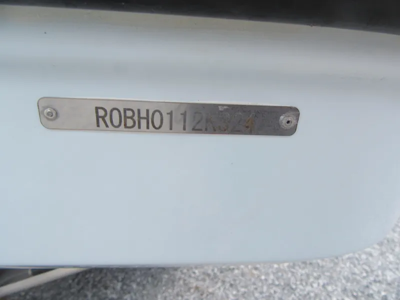 Slide: The Image of 2024 Robalo R317 Dual Console boat identification plate. - 31