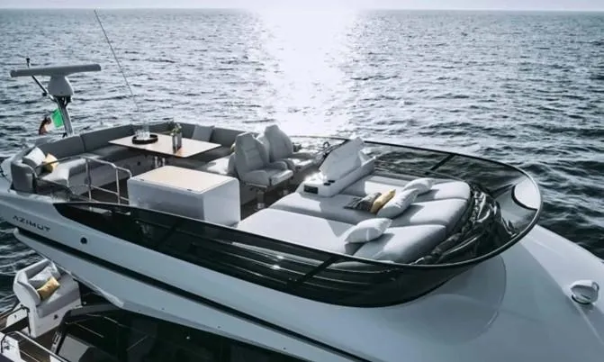 The Image of 2024 Azimut 53 Fly yacht with luxurious deck, cruising on open sea. - 2