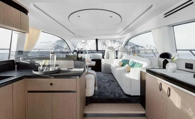 Slide: The Image of Luxurious interior of 2024 Azimut 53 Fly yacht with modern furnishings and panoramic windows. - 5