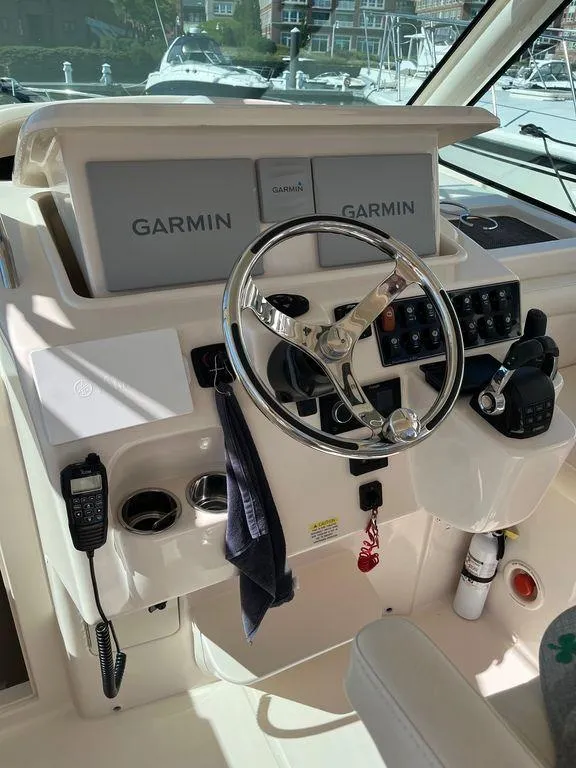 Slide: The Image of Helm of 2020 Grady-White 330 Express with Garmin navigation system. - 22