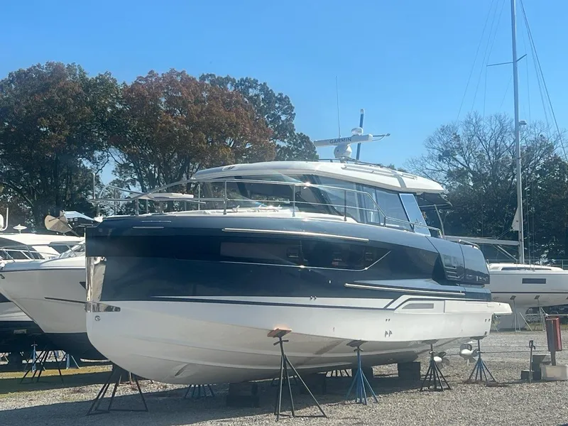 Slide: The Image of 2025 Wellcraft 44 Explorer yacht on display in a marina setting. - 0