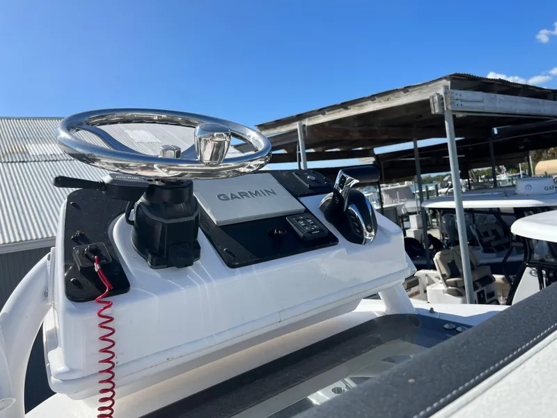 Slide: The Image of 2025 Tidewater 2500 Carolina Bay boat helm with Garmin navigation system. - 13