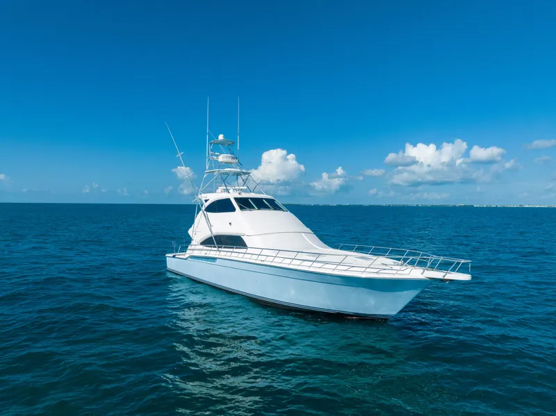 Slide: The Image of 2009 Bertram 630 yacht cruising on open blue ocean. - 22