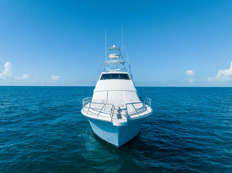 Slide: The Image of Front view of a 2009 Bertram 630 yacht cruising on the open sea. - 23