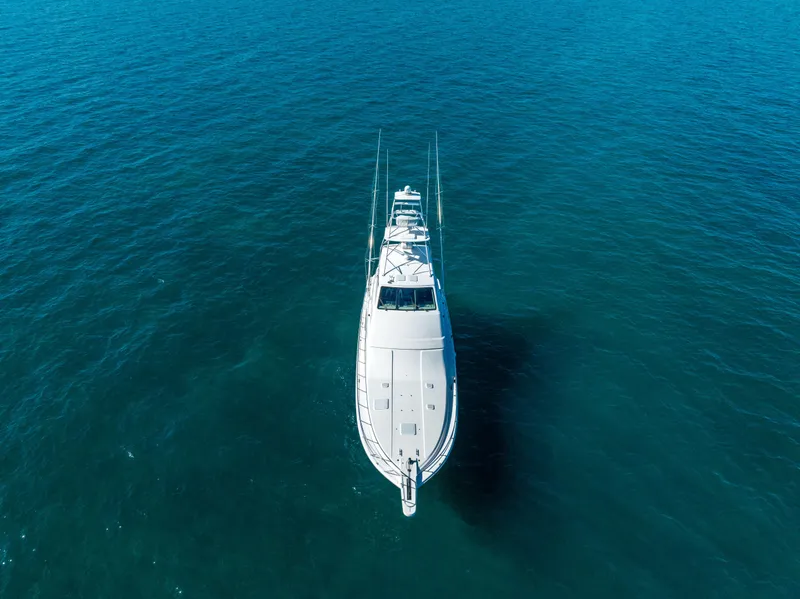 Slide: The Image of Aerial view of a 2009 Bertram 630 yacht cruising on open blue waters. - 24