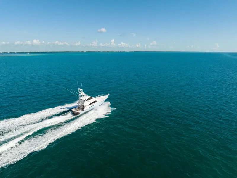 Slide: The Image of Bertram 630 yacht cruising on open blue sea, 2009 model. - 25