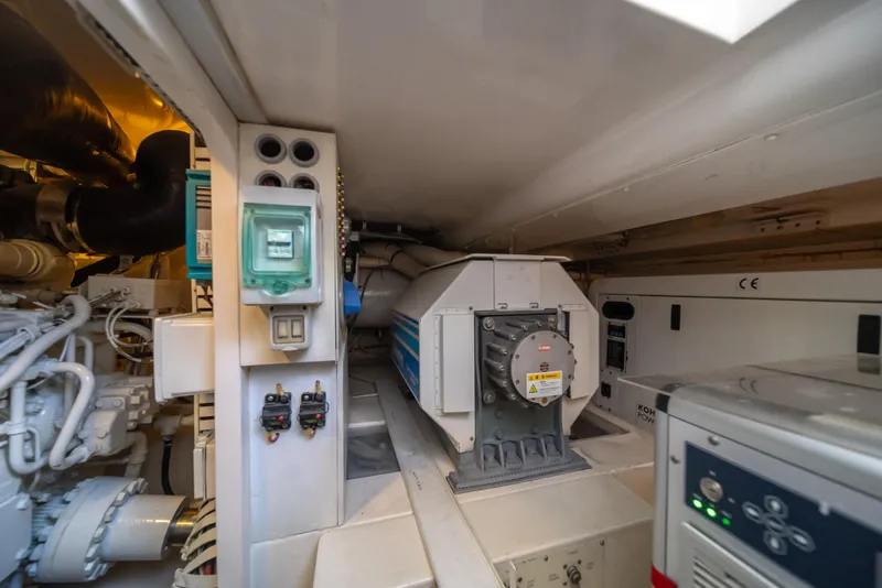 Slide: The Image of Engine room of a 2009 Bertram 630 yacht with various mechanical components. - 44