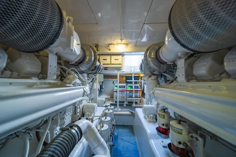 Slide: The Image of Engine room of a 2009 Bertram 630 yacht with dual engines and equipment. - 47