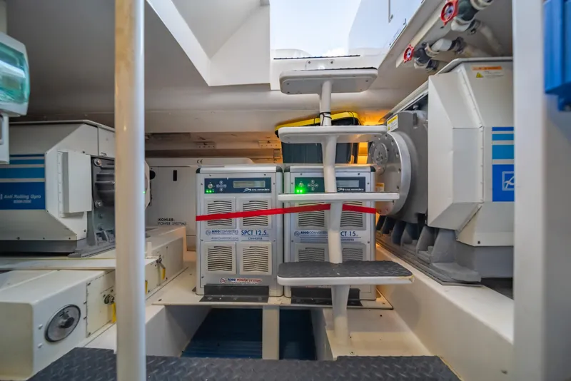 Slide: The Image of Engine room of a 2009 Bertram 630 yacht with power systems and converters. - 48