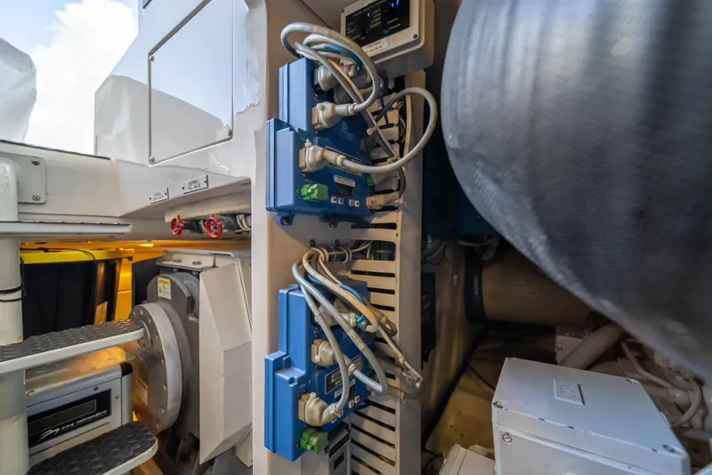 Slide: The Image of Engine room of a 2009 Bertram 630 yacht with electrical components and wiring. - 49