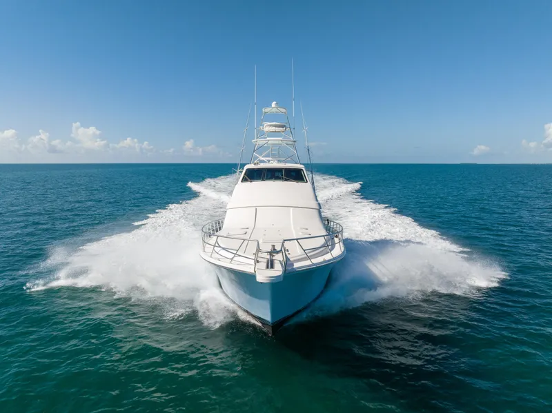 Slide: The Image of 2009 Bertram 630 yacht cruising on open ocean. - 5