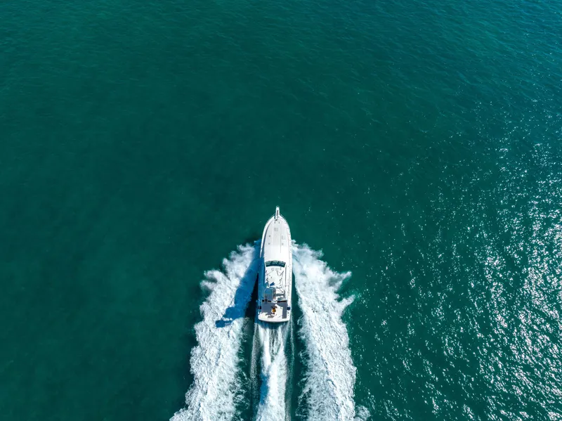 Slide: The Image of Aerial view of a 2009 Bertram 630 yacht cruising on open water. - 7