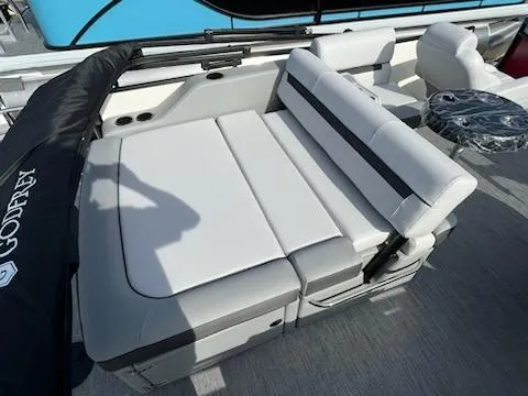 Slide: The Image of 2024 Sweetwater 2286SFL boat with white and gray seating area. - 10